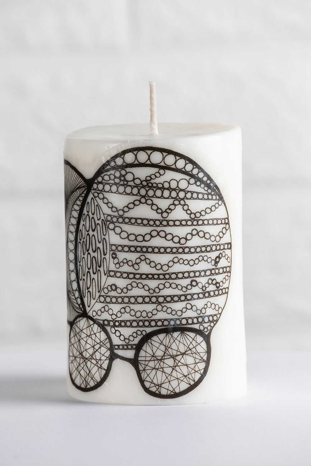 Unscented white vegetable wax pillar candle with drawing